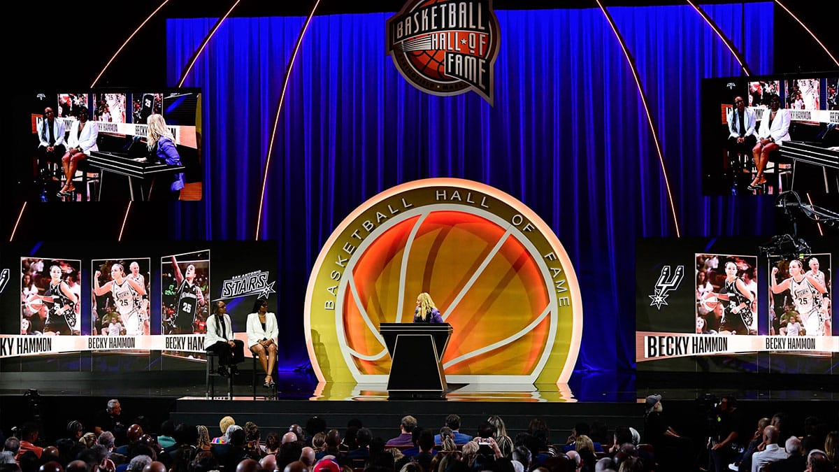 Becky Hammon on stage with her presenters Teresa Weatherspoon ('19) and Sheryl Swoopes ('16) (L to R), during her enshrinement into the 2023 Basketball Hall of Fame