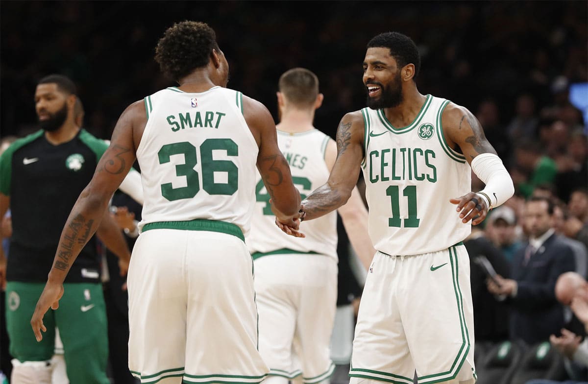 Former Boston Celtics players Kyrie Irving and Marcus Smart