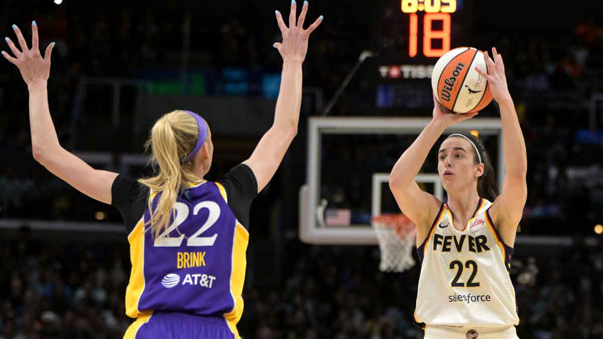 Indiana Fever guard Caitlin Clark (22) is defended by Los Angeles Sparks forward Cameron Brink (22)