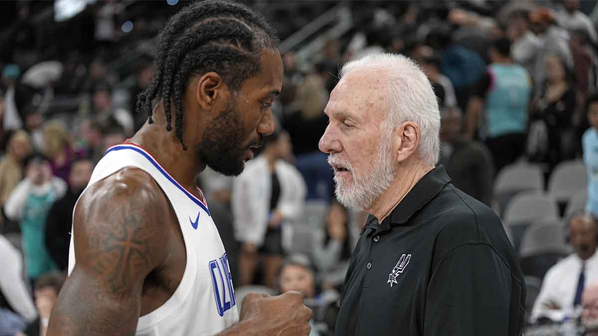San Antonio Spurs head coach Gregg Popovich talks with Los Angeles Clippers forward Kawhi Leonard (2) after a game at Frost Bank Center.