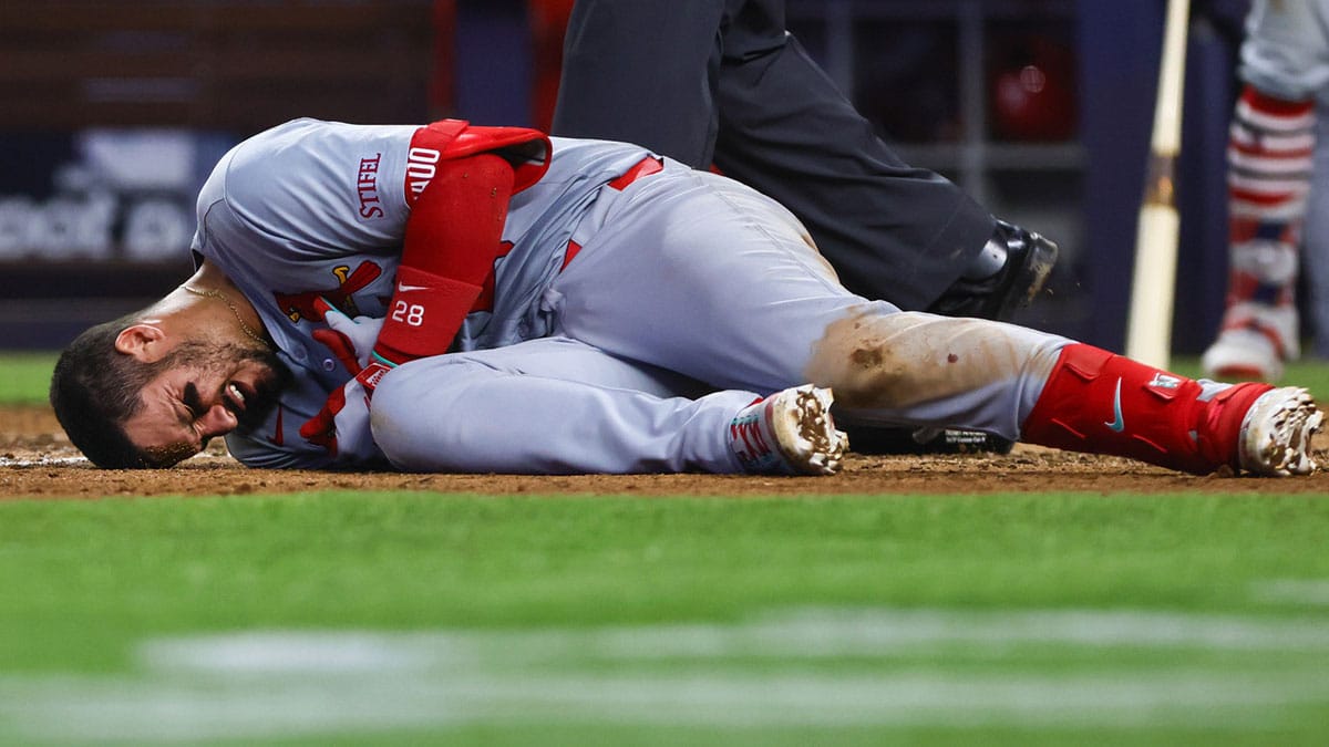 Jun 19, 2024; Miami, Florida, USA; St. Louis Cardinals third baseman Nolan Arenado (28) reacts after getting hit by a pitch during the eighth inning against the Miami Marlins at loanDepot Park. Mandatory Credit: Sam Navarro-USA TODAY Sports
