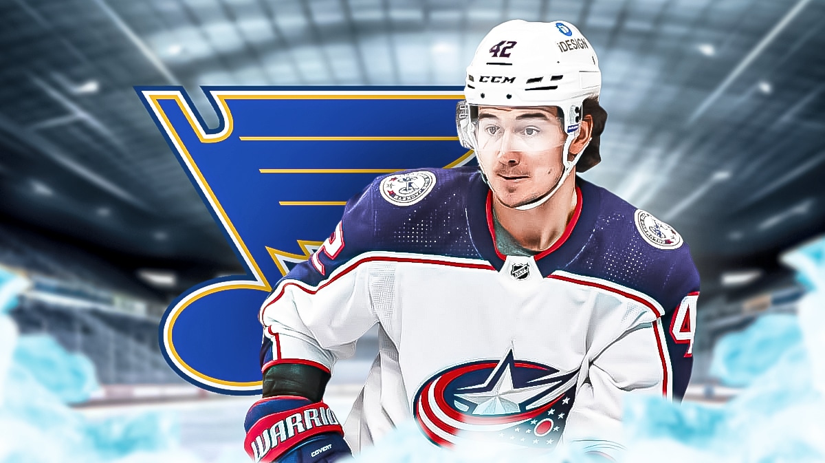 Alex Texier looking hopeful, St. Louis Blues logo, hockey rink in background