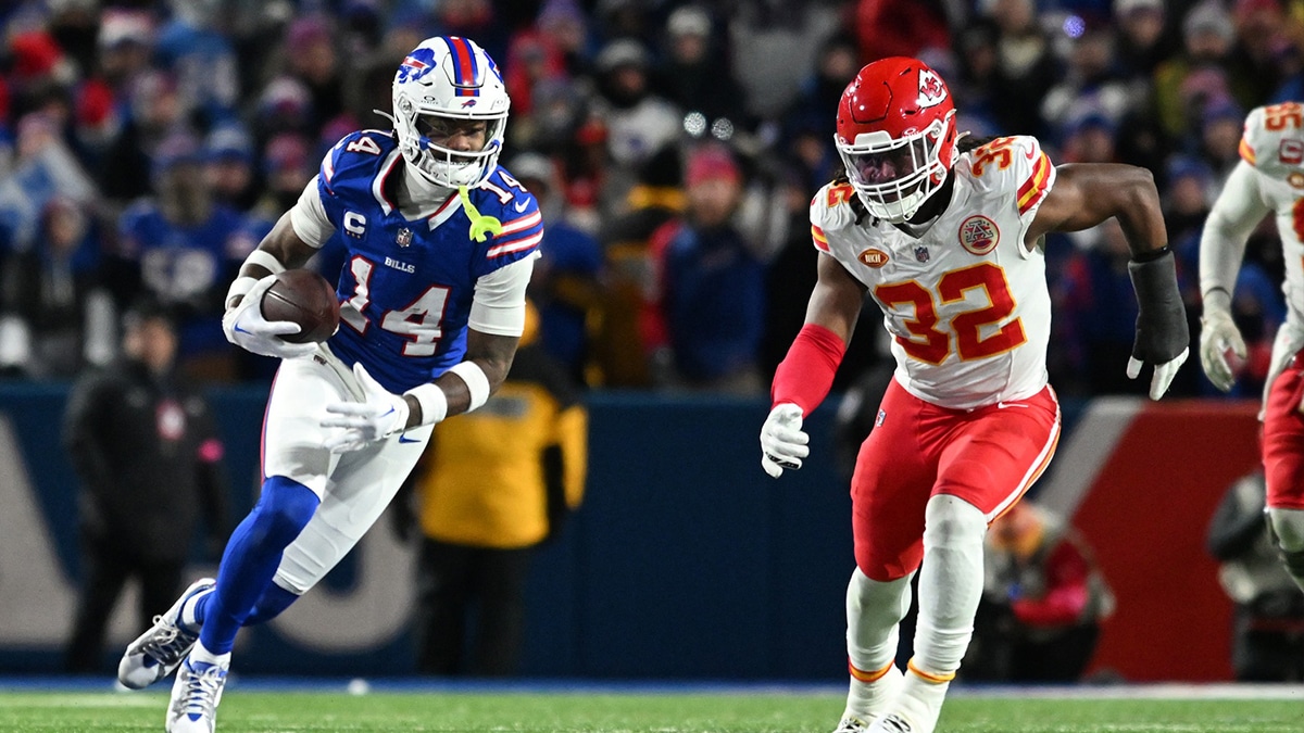 Buffalo Bills wide receiver Stefon Diggs (14) makes a catch against Kansas City Chiefs linebacker Nick Bolton (32) in the first half of the 2024 AFC divisional round game at Highmark Stadium.