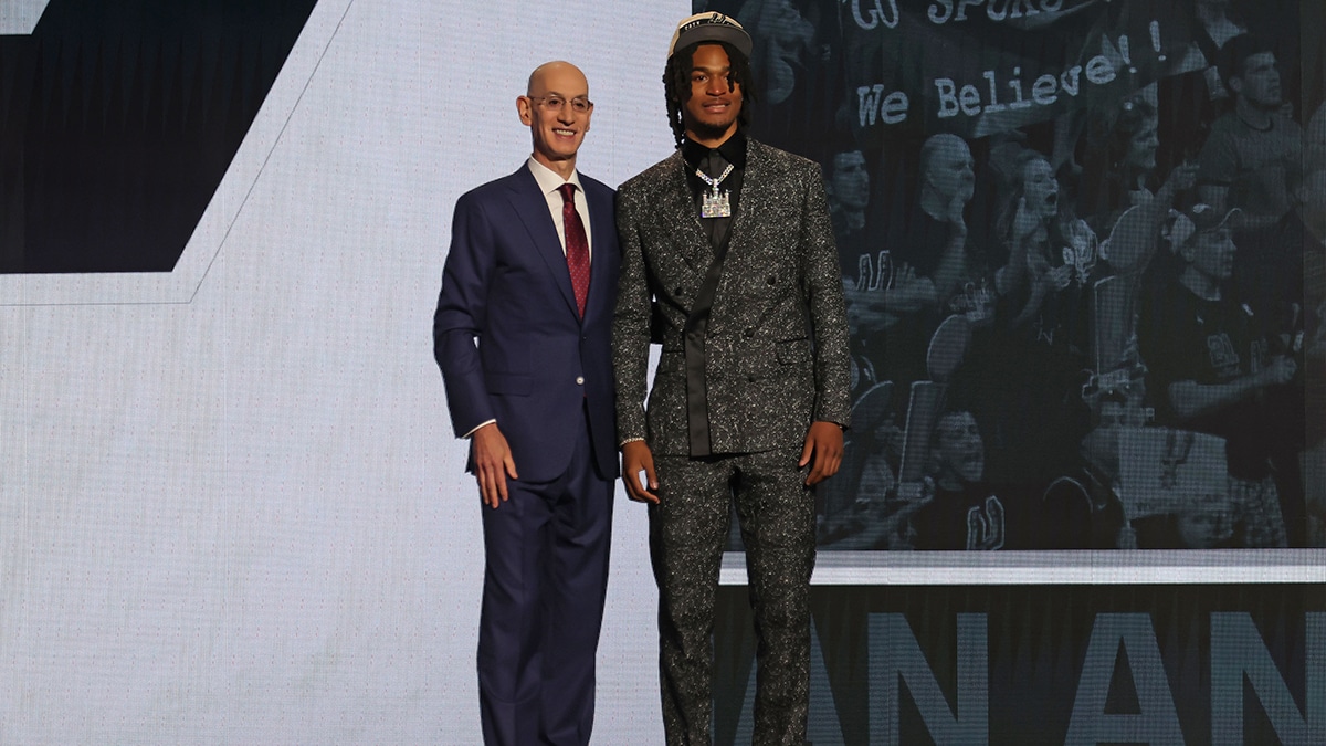 Stephon Castle poses for photos with NBA commissioner Adam Silver after being selected in the first round by the San Antonio Spurs in the 2024 NBA Draft at Barclays Center.