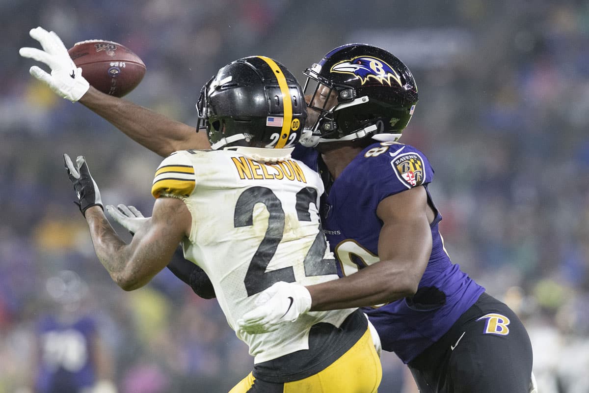 Baltimore Ravens wide receiver Miles Boykin (80) and Pittsburgh Steelers cornerback Steven Nelson (22) battle for a pass during the second quarter at M&T Bank Stadium. 