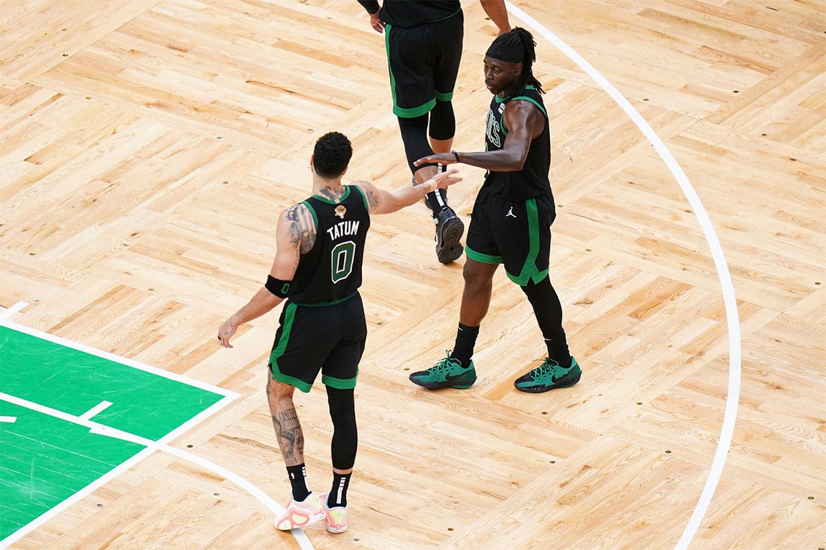 Boston Celtics forward Jayson Tatum (0) and guard Jrue Holiday (4) celebrate after game two against the Dallas Mavericks in the 2024 NBA Finals at TD Garden
