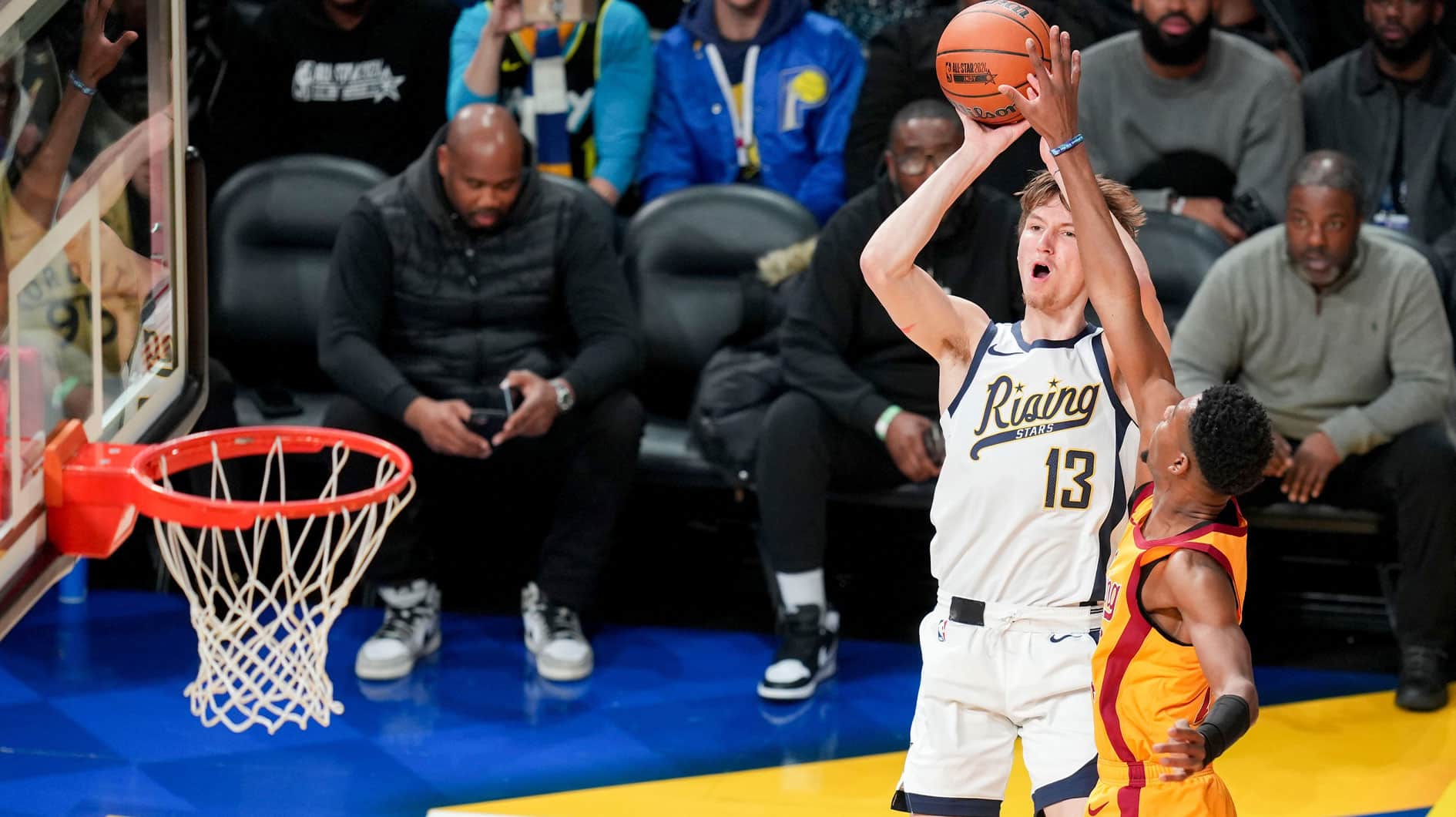 Team Detlef forward Matas Buzelis of G League Ignite goes up for the winning shot over Team Pau forward Brandon Miller of the Charlotte Hornets during a Rising Stars semifinal game at Gainbridge Fieldhouse, Feb. 16, 2024 in Indianapolis.