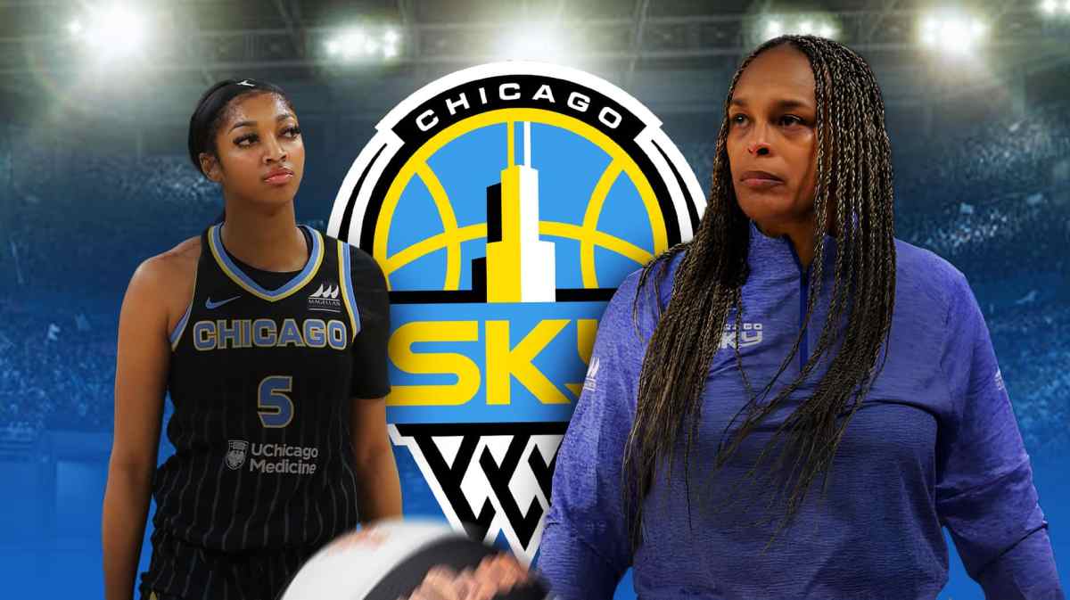Sky's Teresa Weatherspoon stands next to Angel Reese during Mystics game