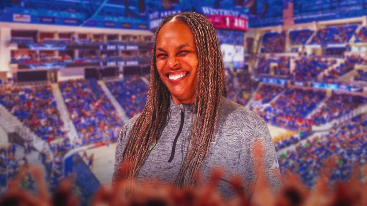 Teresa Weatherspoon stands in front of Wintrust Arena, Chicago Sky fans after Lynx game