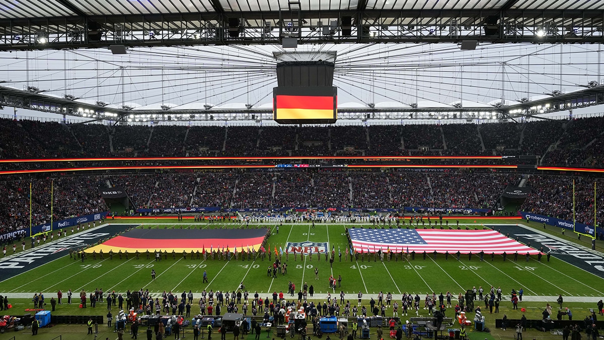 A general overall view of the playing of the national anthem with German and United States flags on the field during an NFL International Series game between the Indianapolis Colts and the New England Patriots at Deutsche Bank Park.