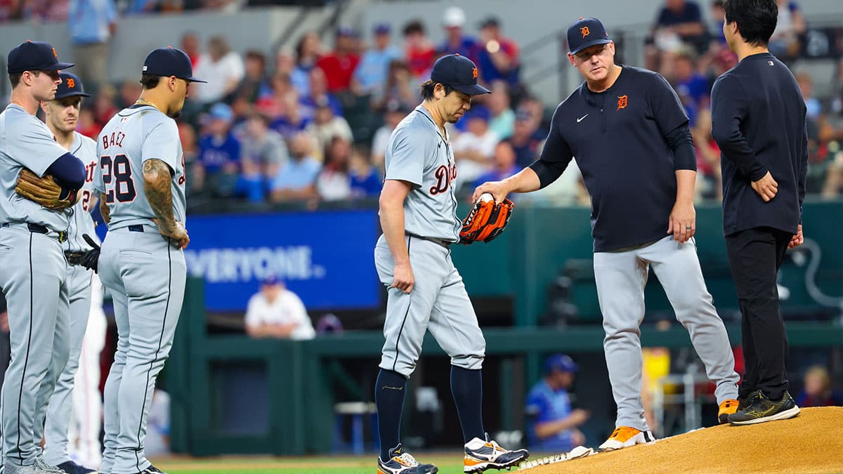 Detroit Tigers manager A.J. Hinch (14) takes the ball from Detroit Tigers pitcher Kenta Maeda (18) during the first inning against the Texas Rangers at Globe Life Field.