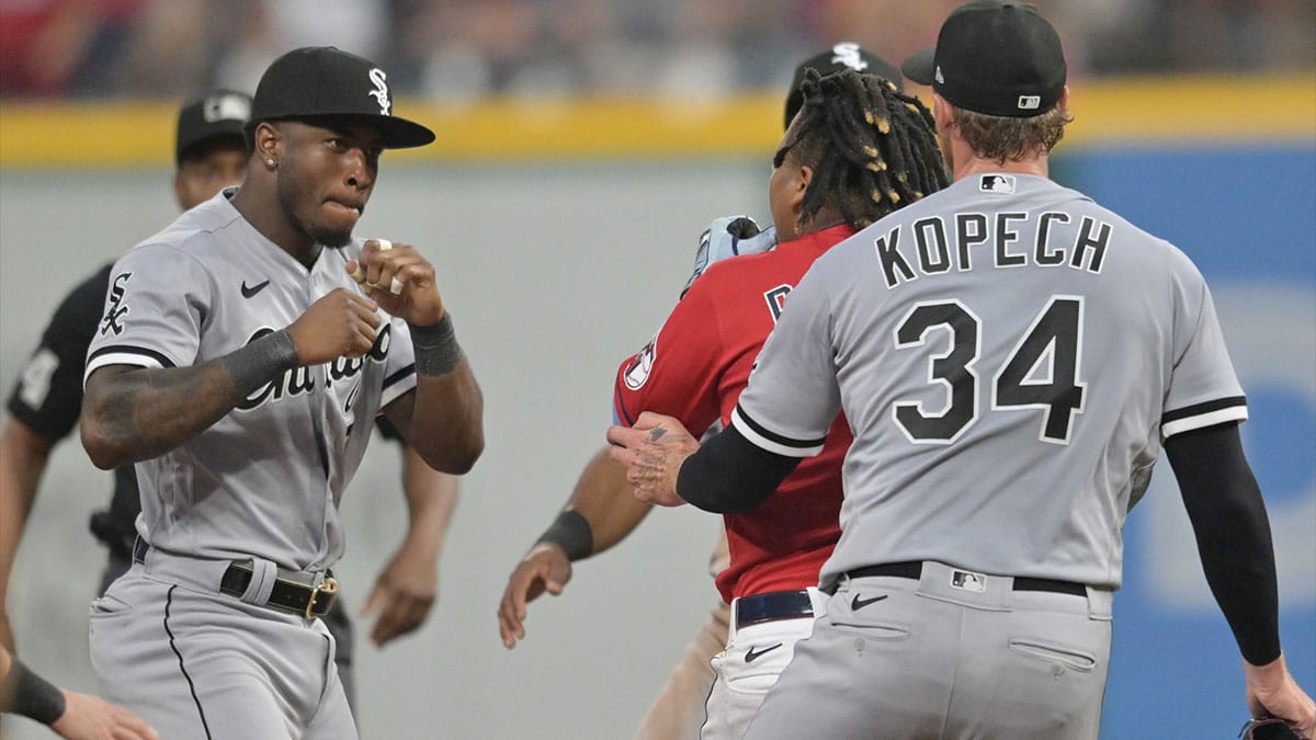 Chicago White Sox shortstop Tim Anderson (7) raises his fists to fight Cleveland Guardians third baseman Jose Ramirez (11) during the sixth inning at Progressive Field.