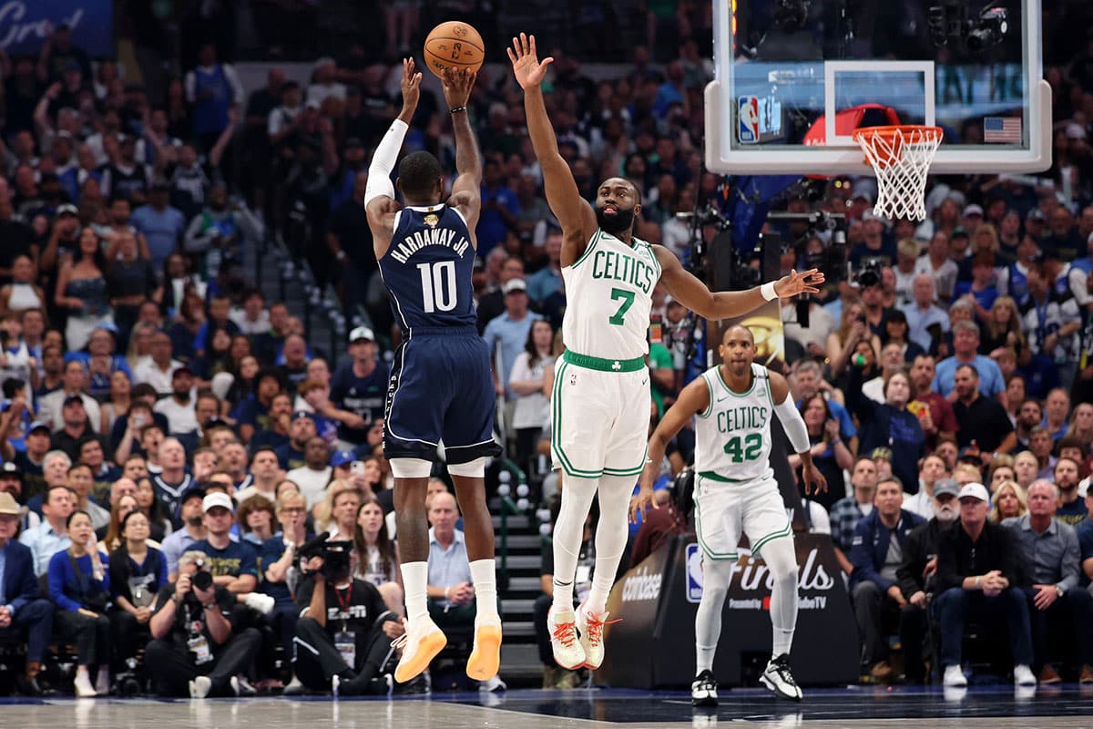Dallas Mavericks forward Tim Hardaway Jr. (10) shoots the ball against Boston Celtics guard Jaylen Brown (7) during the second quarter during game three of the 2024 NBA Finals at American Airlines Center. 