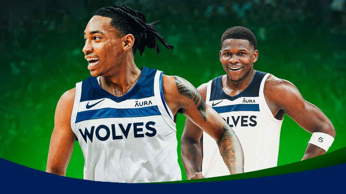 Rob Dillingham in a Timberwolves uni, with Anthony Edwards smiling beside him