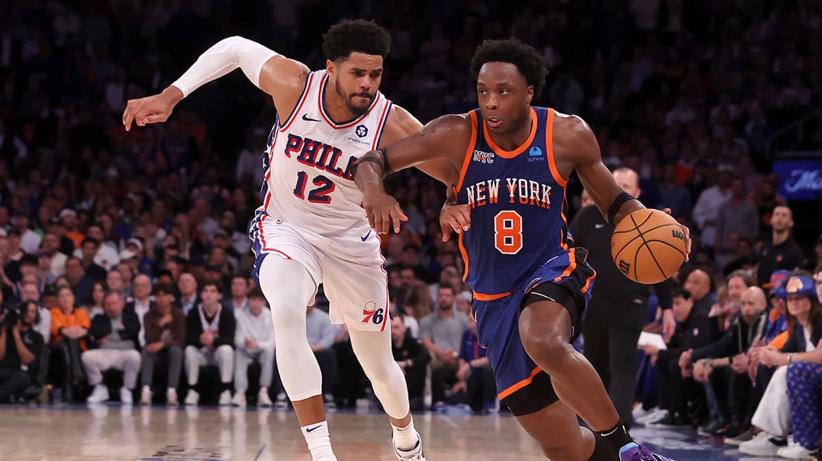 New York Knicks forward OG Anunoby (8) brings the ball up court against Philadelphia 76ers forward Tobias Harris (12) during the fourth quarter of game 5 of the first round of the 2024 NBA playoffs at Madison Square Garden.