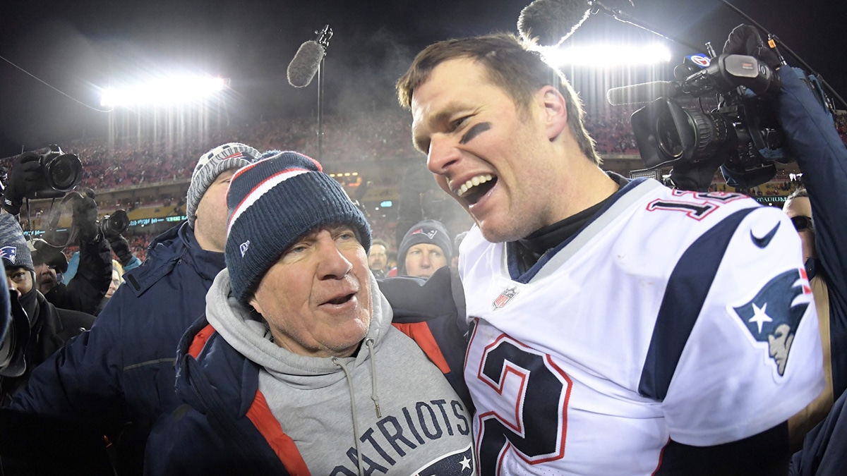 New England Patriots quarterback Tom Brady (12) celebrates with coach Bill Belichick after the AFC Championship game against the Kansas City Chiefs at Arrowhead Stadium. The Patriots defeated the Chiefs 37-31 in overtime to advance to fifth Super Bowl in eight seasons. 