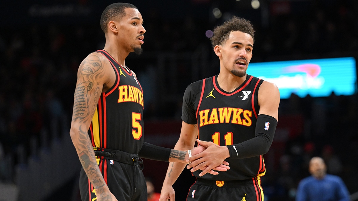tlanta Hawks guard Dejounte Murray (5) and guard Trae Young (11) celebrate during the second half against the Washington Wizards at Capital One Arena.