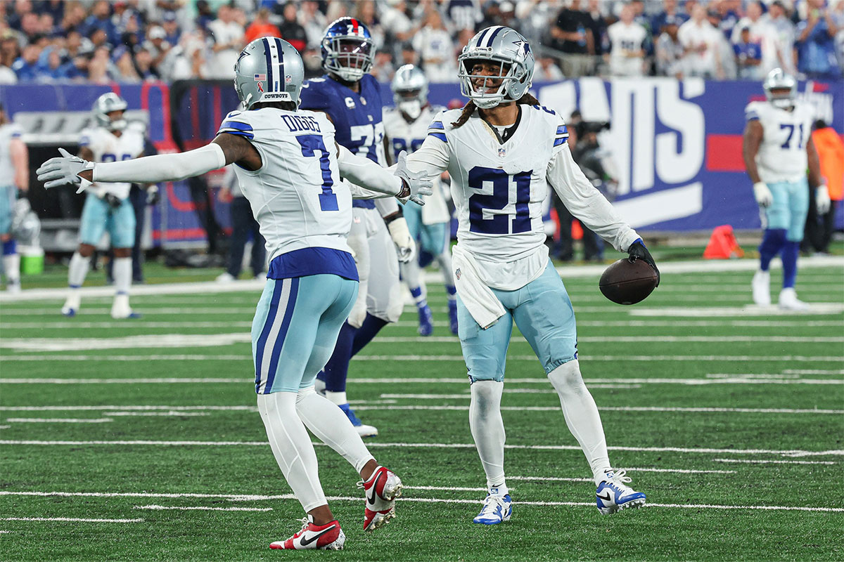  Dallas Cowboys cornerback Stephon Gilmore (21) celebrates his interception with cornerback Trevon Diggs (7) during the first half against the New York Giants at MetLife Stadium.