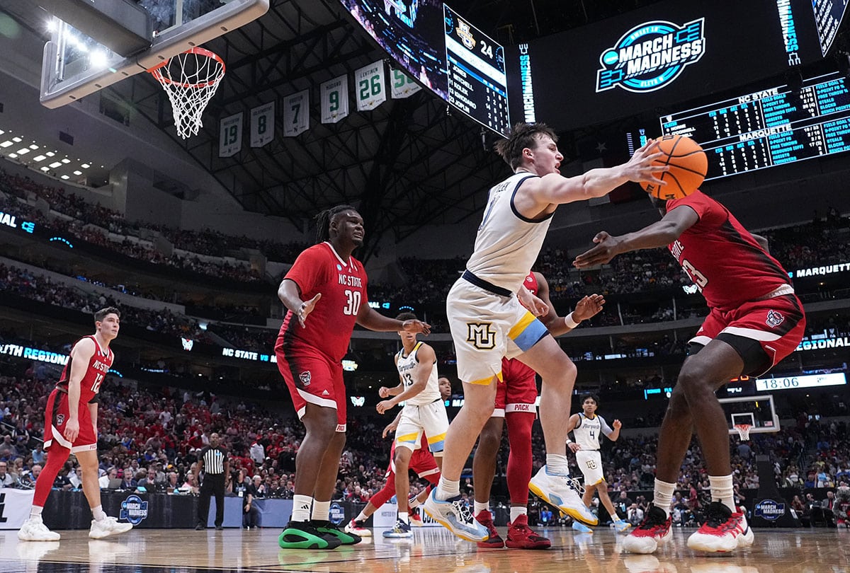 Marquette guard Tyler Kolek (11) finds an open teammate during the second half of their game in the semifinals of the South Regional of the 2024 NCAA Men's Basketball Tournament Friday at American Airlines Arena in Dallas. North Carolina State beat Marquette 67-58.