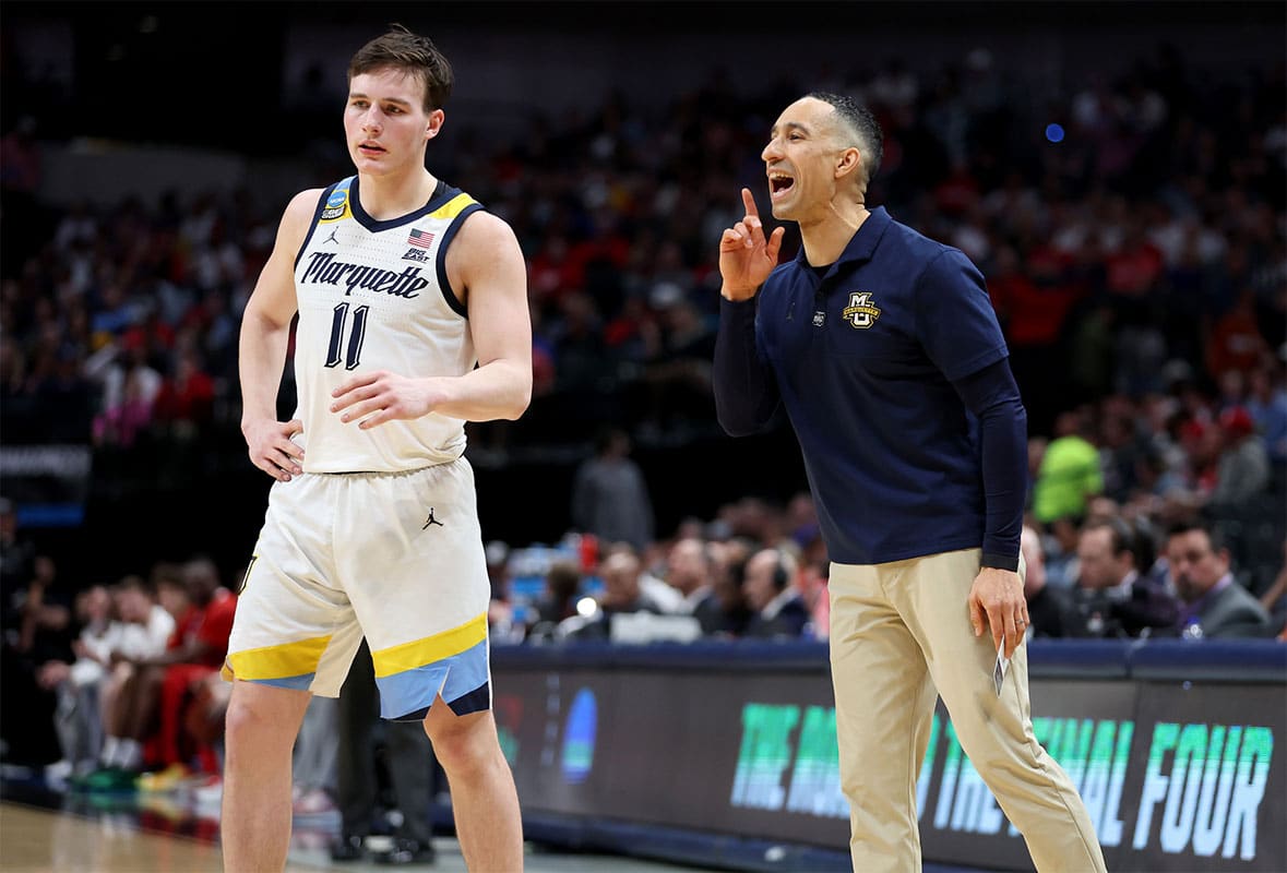 Marquette Golden Eagles head coach Shaka Smart talks to guard Tyler Kolek (11) during the first half in the semifinals of the South Regional of the 2024 NCAA Tournament against the North Carolina State Wolfpack at American Airlines Center.