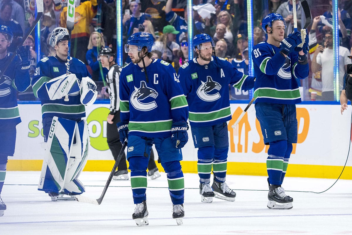  Vancouver Canucks defenseman Quinn Hughes (43) and forward J.T. Miller (9) and defenseman Nikita Zadorov (91) and goalie Arturs Silvos (31) wave to the crowd after the Edmonton Oilers win in game seven of the second round of the 2024 Stanley Cup Playoffs at Rogers Arena.