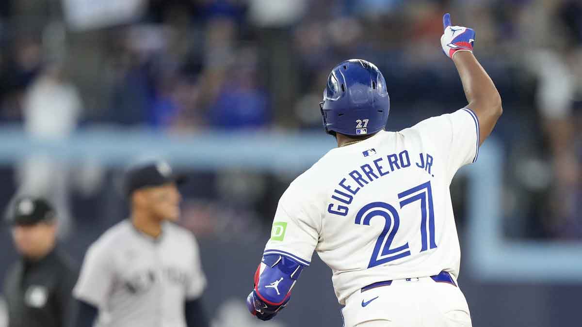Toronto Blue Jays first baseman Vladimir Guerrero Jr. (27) celebrates his solo home run against the New York Yankees as he runs to second base during the sixth inning at Rogers Centre