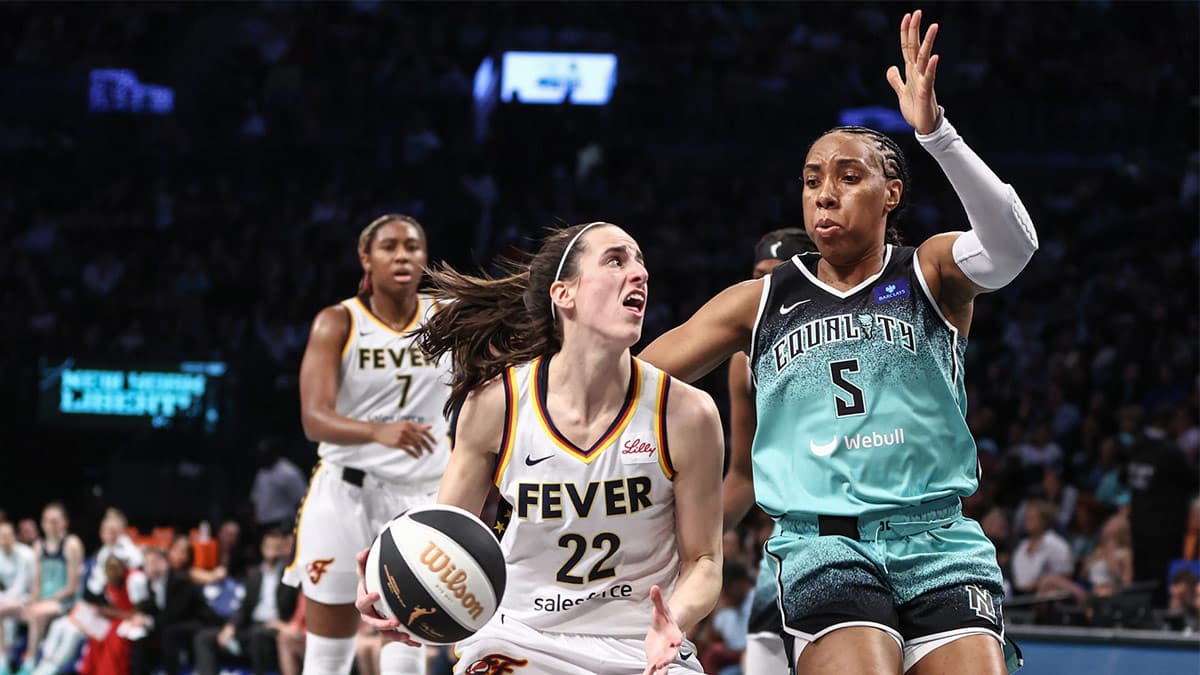 Indiana Fever guard Caitlin Clark (22) looks to drive past New York Liberty forward Kayla Thornton (5) in the second quarter at Barclays Center.