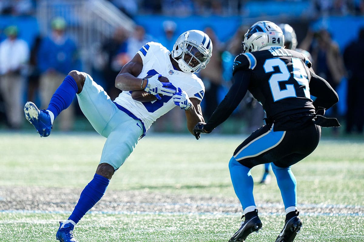 Dallas Cowboys wide receiver Jalen Tolbert (18) and Carolina Panthers safety Vonn Bell (24) during the second quarter at Bank of America Stadium. 