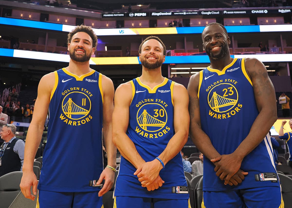 Golden State Warriors guard Klay Thompson (11), guard Stephen Curry (30) and forward Draymond Green (23) after the game against the Los Angeles Clippers at Chase Center.
