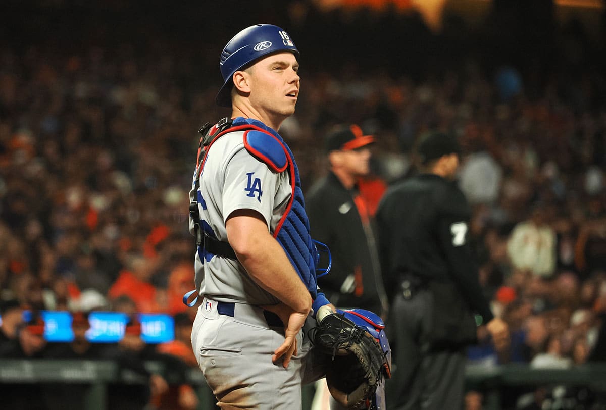 Los Angeles Dodgers catcher Will Smith (16) reacts as a call is reviewed against the San Francisco Giants during the ninth inning at Oracle Park.