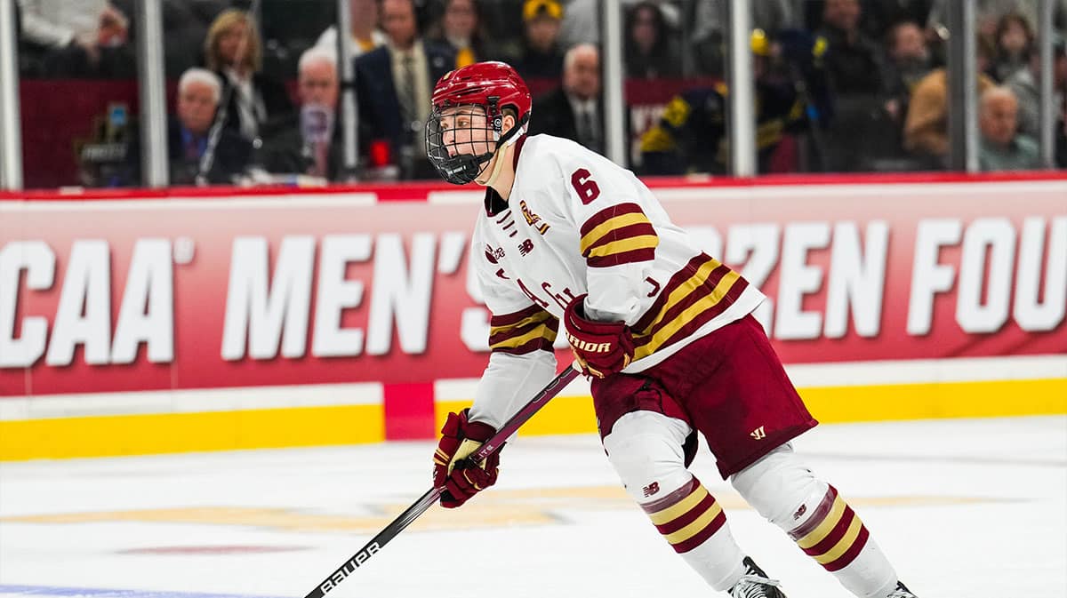 Boston College Eagles forward Will Smith (6) carries the puck in the semifinals of the 2024 Frozen Four college ice hockey tournament during the second period against the Michigan Wolverines at Xcel Energy Center.