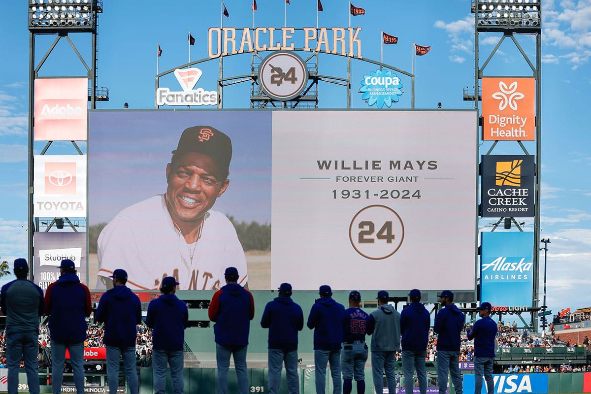 Chicago Cubs players stand during a moment of silence in honor of Willie Mays before the game against San Francisco Giants at Oracle Park.