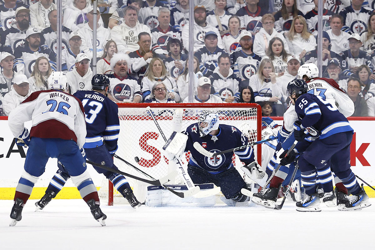 Colorado Avalanche center Yakov Trenin (73) scores on Winnipeg Jets goaltender Connor Hellebuyck (37) in the second period in game five of the first round of the 2024 Stanley Cup Playoffs at Canada Life Centre.