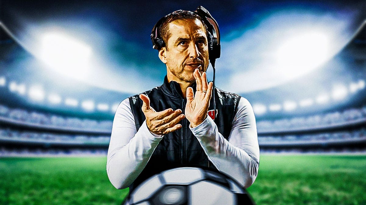 Wisconsin football coach Luke Fickell clapping.