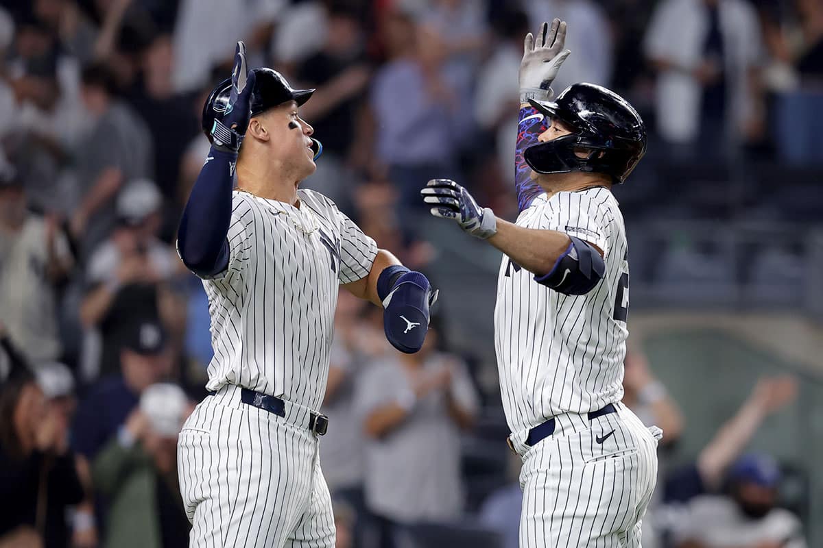 New York Yankees designated hitter Giancarlo Stanton (27) celebrates his two run home run against the Minnesota Twins with center fielder Aaron Judge (99) during the eighth inning at Yankee Stadium.