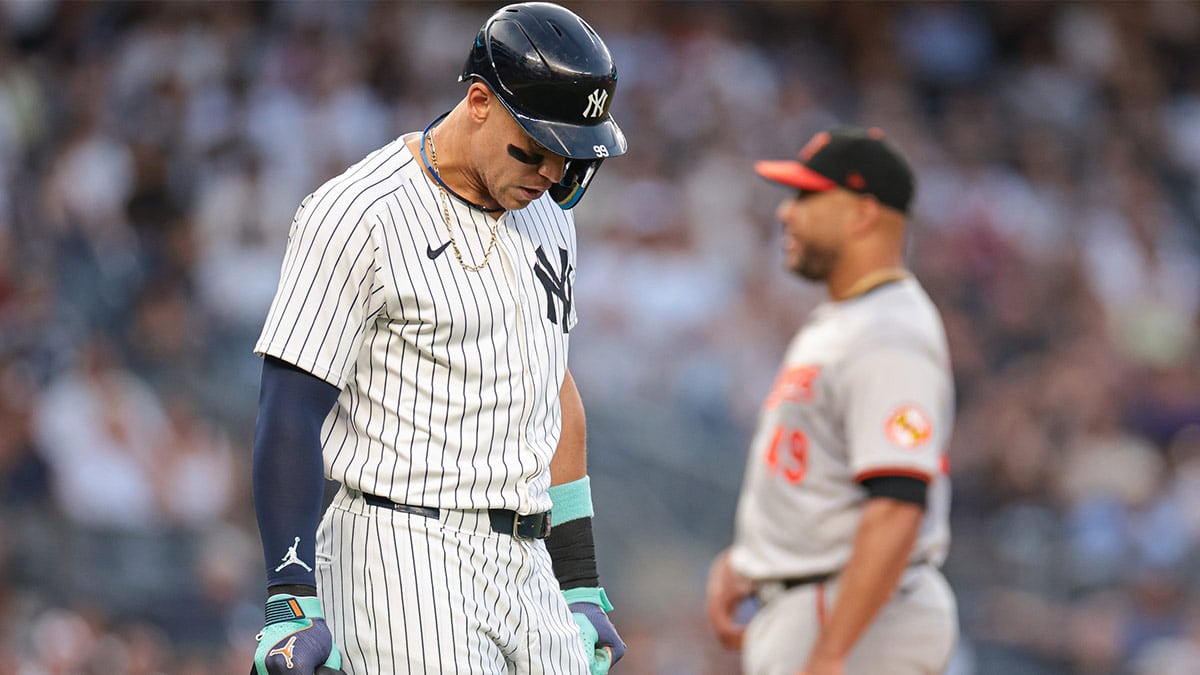 New York Yankees center fielder Aaron Judge (99) walks first base after being hit by a pitch during the third inning by Baltimore Orioles starting pitcher Albert Suarez (49) at Yankee Stadium. 