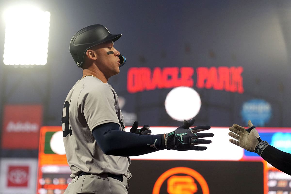 New York Yankees designated hitter Aaron Judge (left) is congratulated by second baseman Gleyber Torres (not pictured) after hitting a home run against the San Francisco Giants during the sixth inning at Oracle Park.