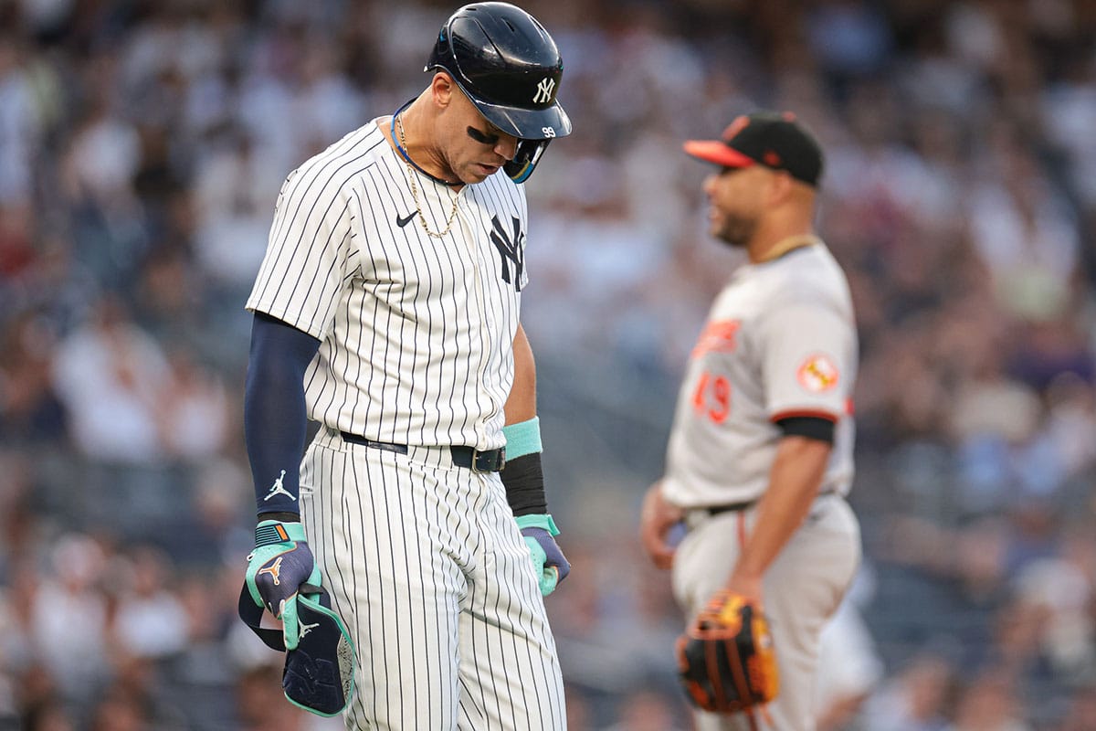 New York Yankees center fielder Aaron Judge (99) walks first base after being hit by a pitch during the third inning by Baltimore Orioles starting pitcher Albert Suarez (49) at Yankee Stadium. 