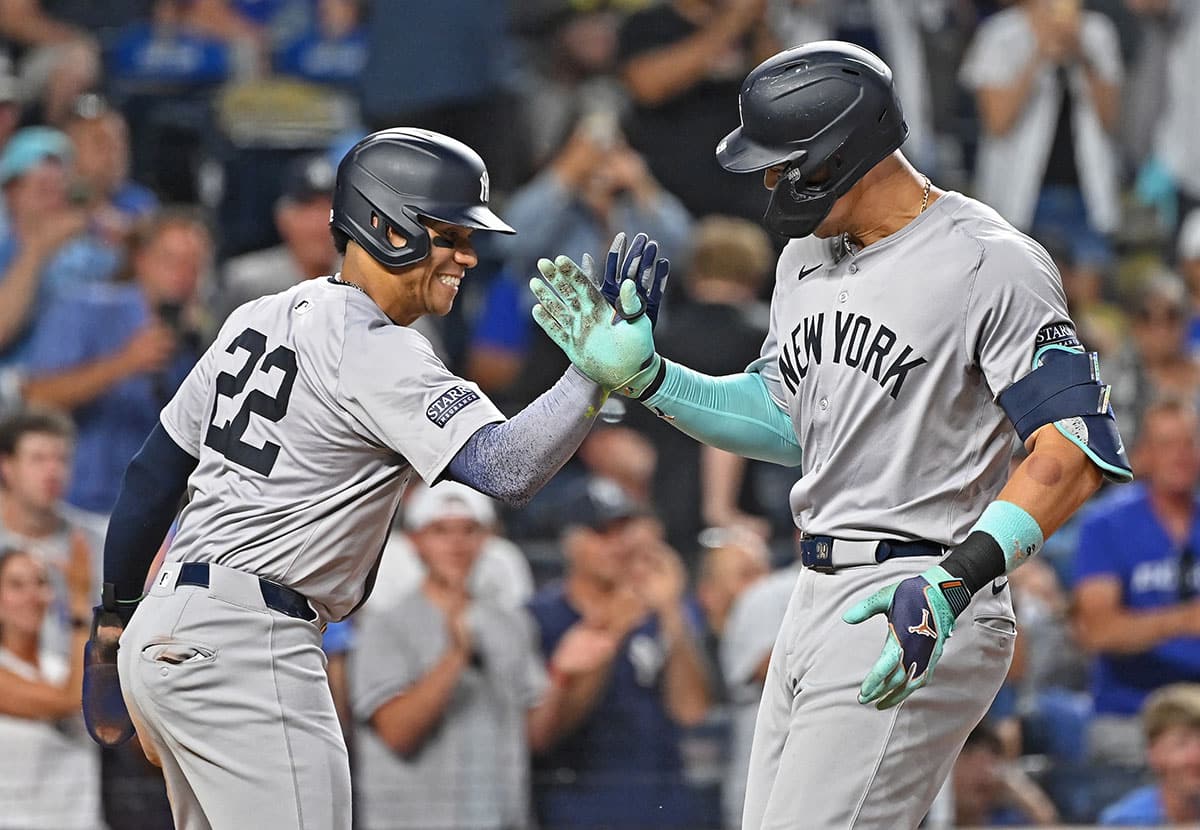 New York Yankees center fielder Aaron Judge (99) celebrates with Juan Soto (22) after hitting a two-run home run in the seventh inning against the Kansas City Royals at Kauffman Stadium.