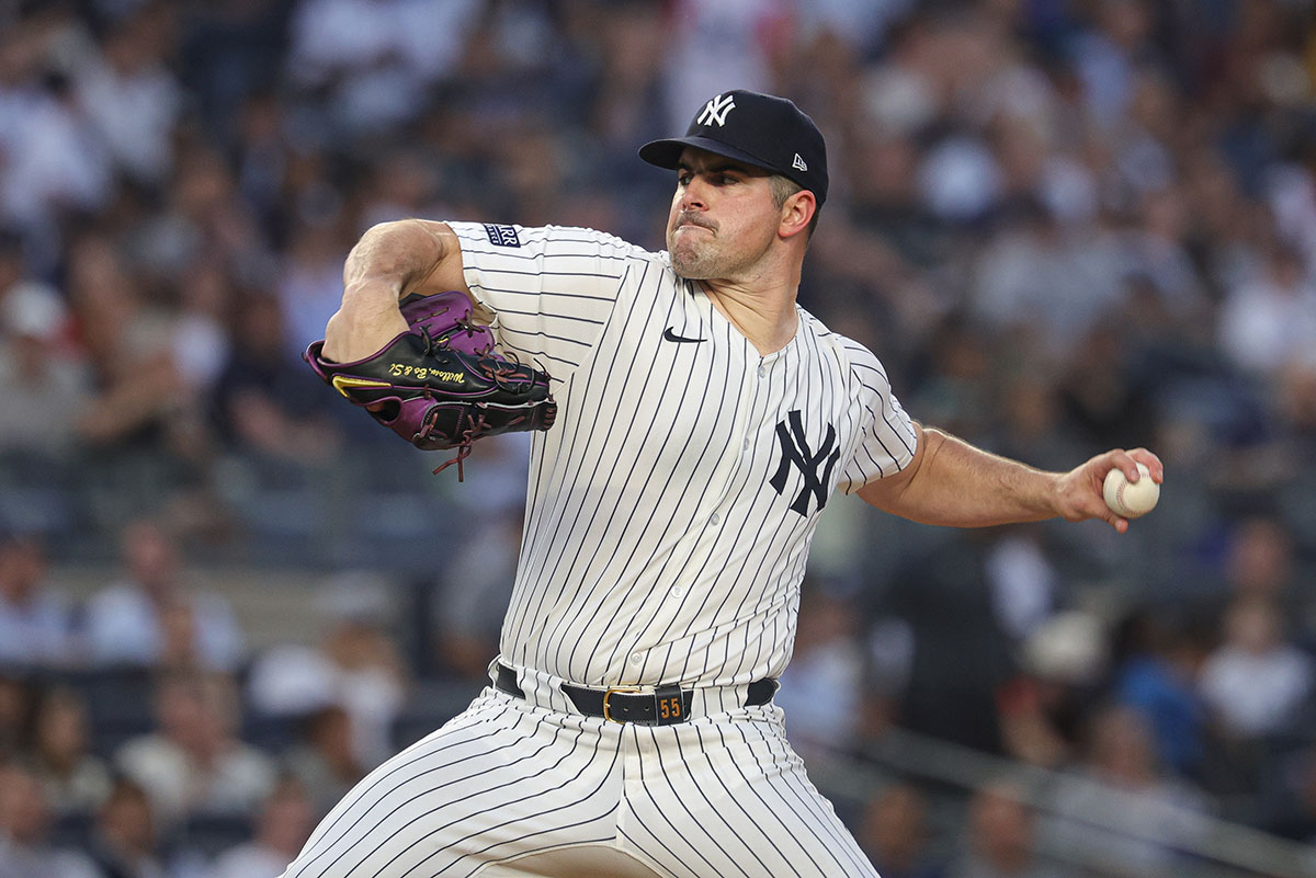 New York Yankees starting pitcher Carlos Rodon (55) delivers a pitch during the fourth inning against the Minnesota Twins at Yankee Stadium.