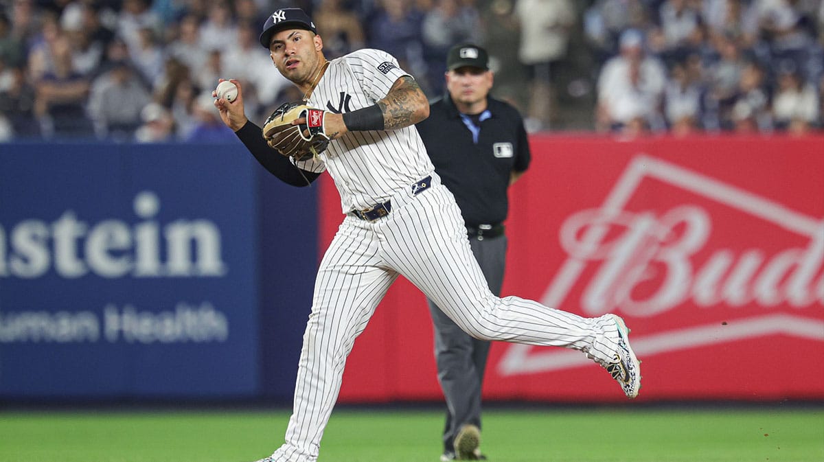 New York Yankees second baseman Gleyber Torres (25) throws the ball to first base for an out during the seventh inning against the Minnesota Twins at Yankee Stadium. 