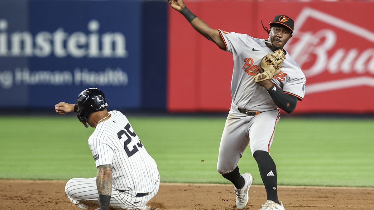 Baltimore Orioles second baseman Jorge Mateo (3) throws past New York Yankees second baseman Gleyber Torres (25) for an inning ending double play in the seventh inning at Yankee Stadium