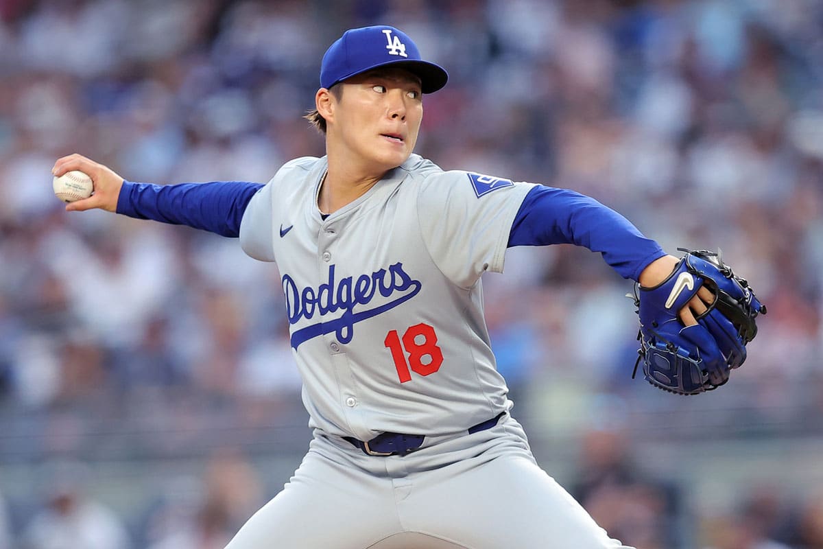 Los Angeles Dodgers starting pitcher Yoshinobu Yamamoto (18) pitches against the New York Yankees during the second inning at Yankee Stadium.