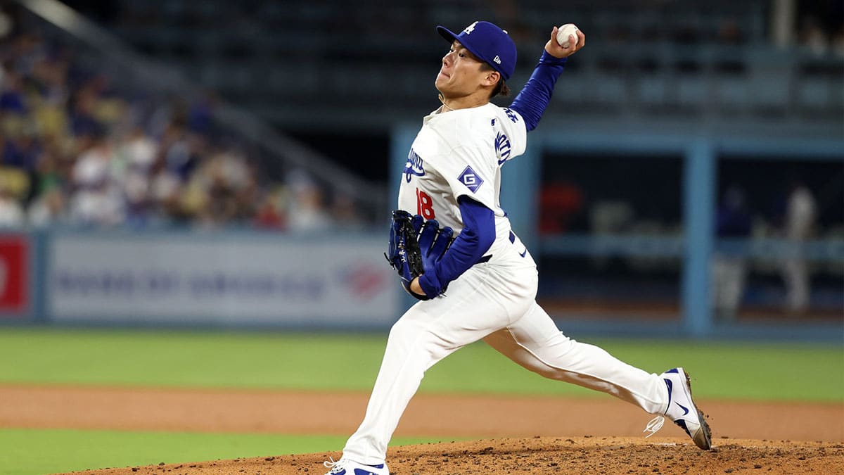 Los Angeles Dodgers starting pitcher Yoshinobu Yamamoto (18) pitches during the sixth inning against the Colorado Rockies at Dodger Stadium.