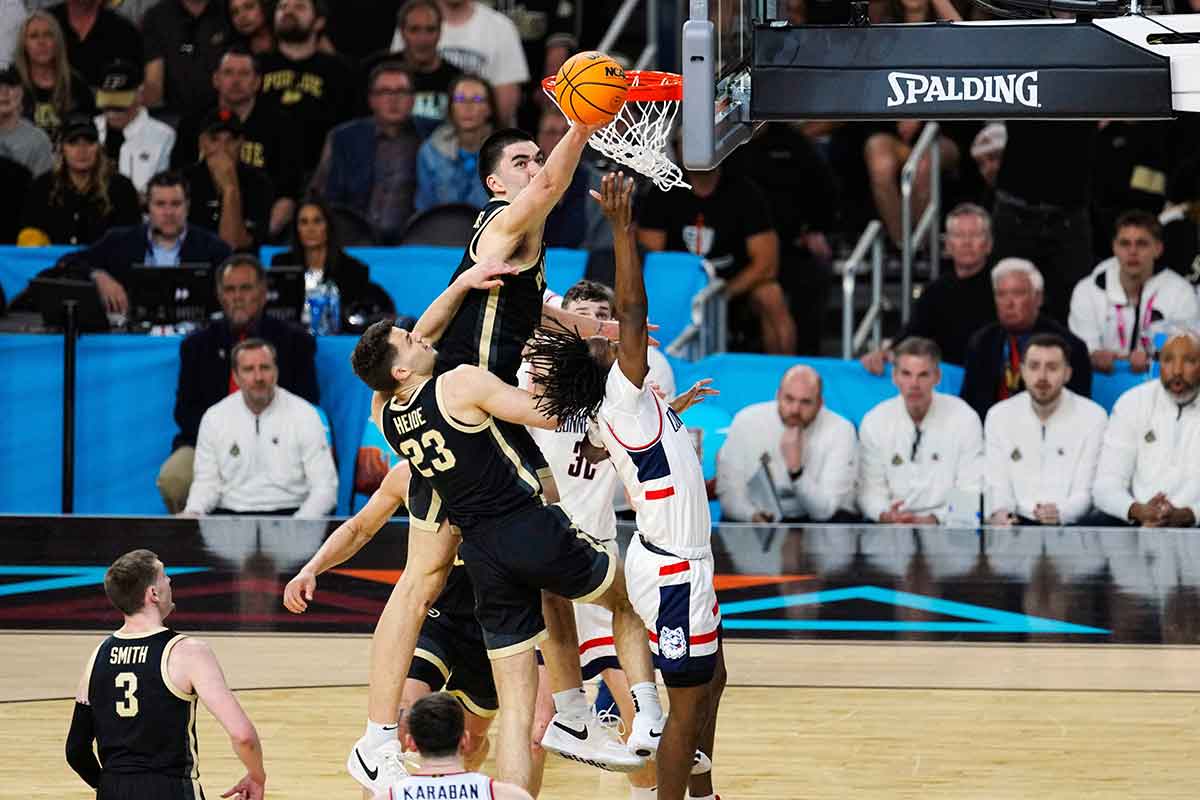 Purdue Boilermakers center Zach Edey (15) blocks Connecticut Huskies guard Tristen Newton (2) in the first half in the national championship game of the Final Four of the 2024 NCAA Tournament at State Farm Stadium