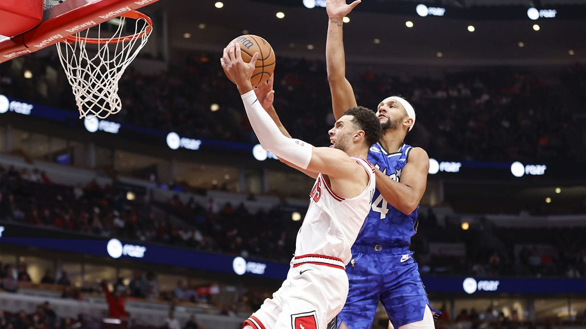 Chicago Bulls guard Zach LaVine (8) goes to the basket against Orlando Magic guard Jalen Suggs (4) during the first half at United Center. 