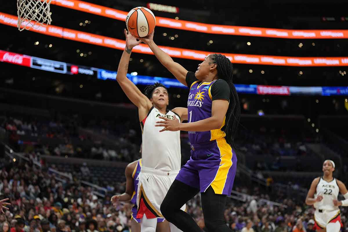 LA Sparks guard Zia Cooke (1) shoots the ball against Las Vegas Aces forward Candace Parker (3) during the first half at Crypto.com Arena.