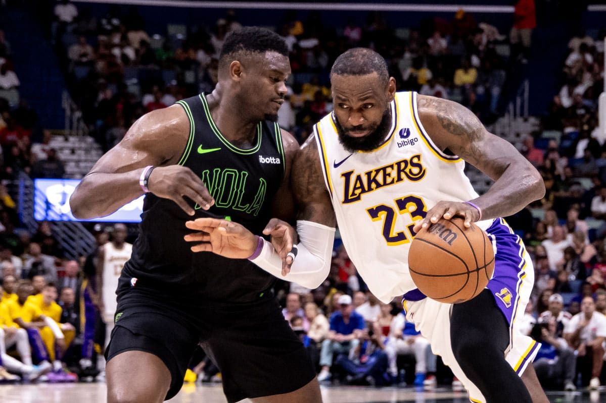 Los Angeles Lakers forward LeBron James (23) dribbles against New Orleans Pelicans forward Zion Williamson (1) during the second half at Smoothie King Center.