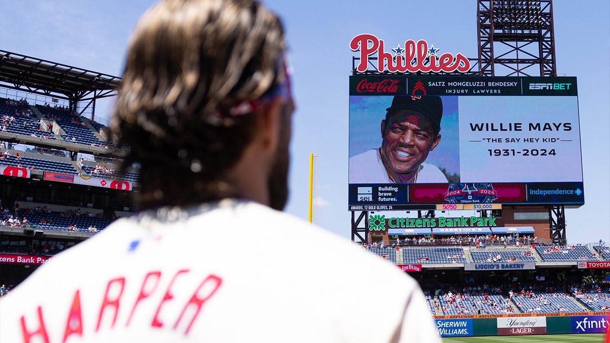 Jun 19, 2024; Philadelphia, Pennsylvania, USA; Philadelphia Phillies first base Bryce Harper stands for a moment of silence in honor of the late Willie Mays before a game against the San Diego Padres at Citizens Bank Park. Mandatory Credit: Bill Streicher-USA TODAY Sports