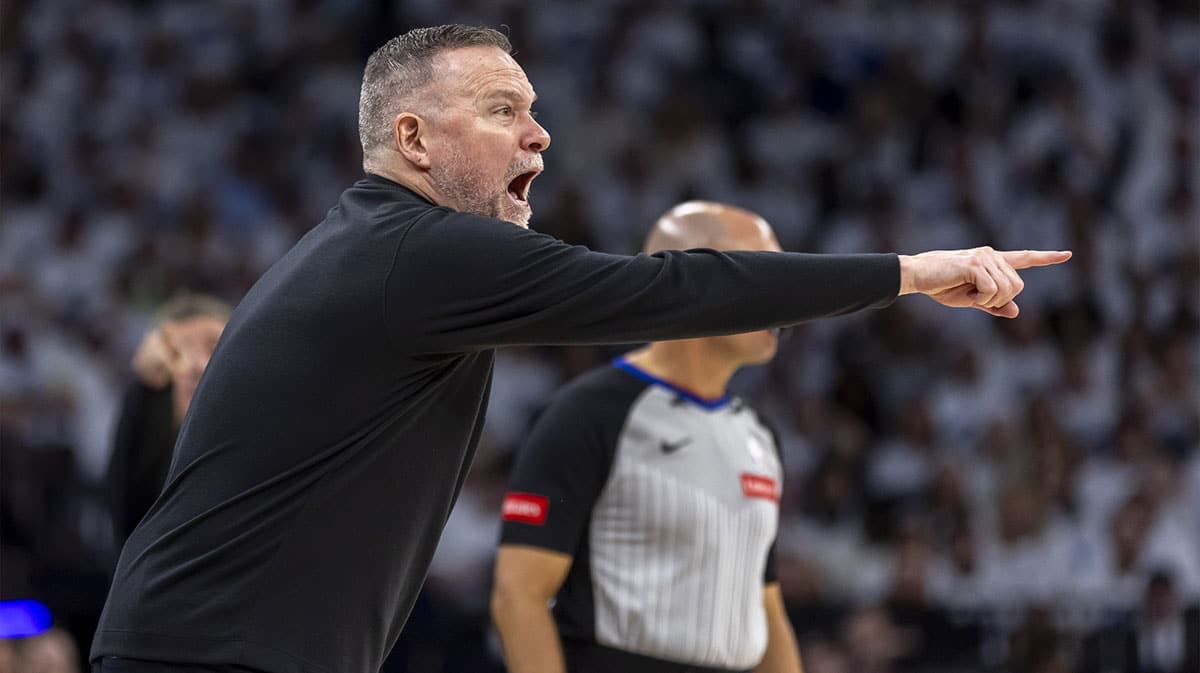Denver Nuggets head coach Michael Malone calls out a play to his team against the Minnesota Timberwolves in the first half during game three of the second round for the 2024 NBA playoffs at Target Center. 